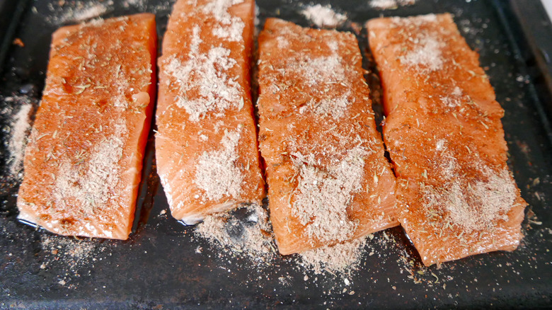 applying spices to the fish