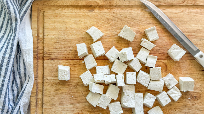 chopped tofu on board