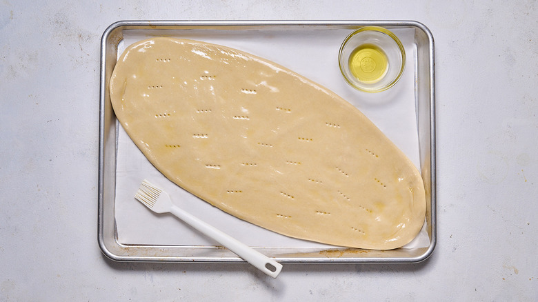 brushing flatbread with oil