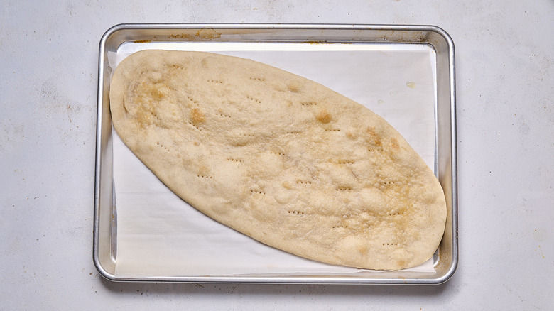 baked flatbread on baking sheet