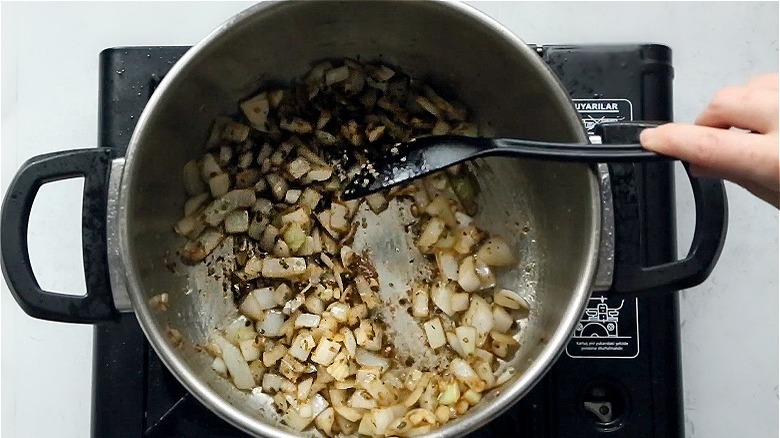 sautéeing onions in pot