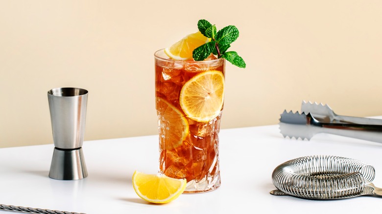 Long Island iced tea with bar tools