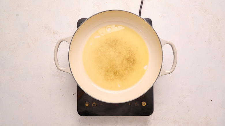heating olive oil in skillet