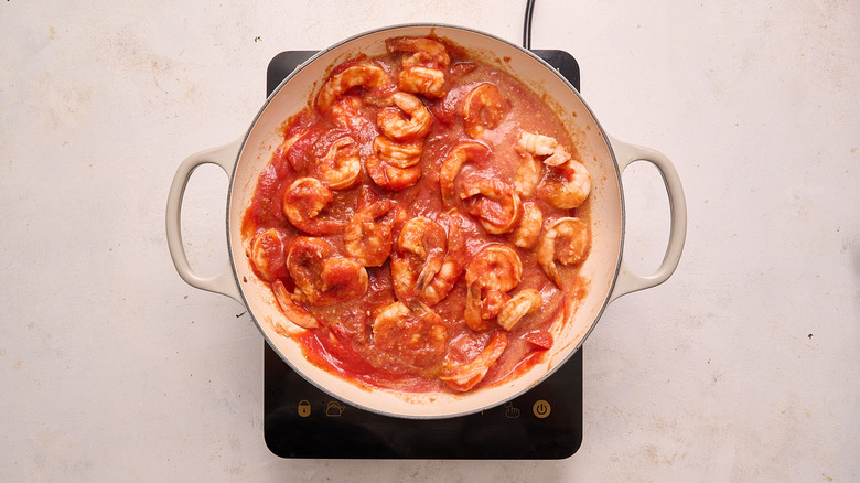 tomato sauce in skillet with shrimp