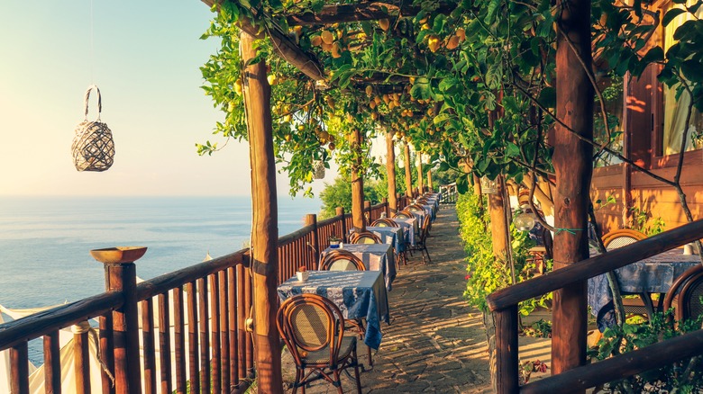 Coastal outdoor restaurant with lemon trees