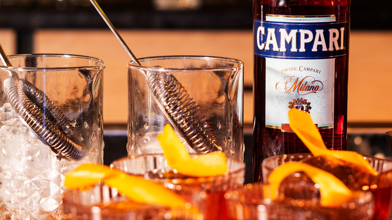 Campari cocktails with mixing glasses