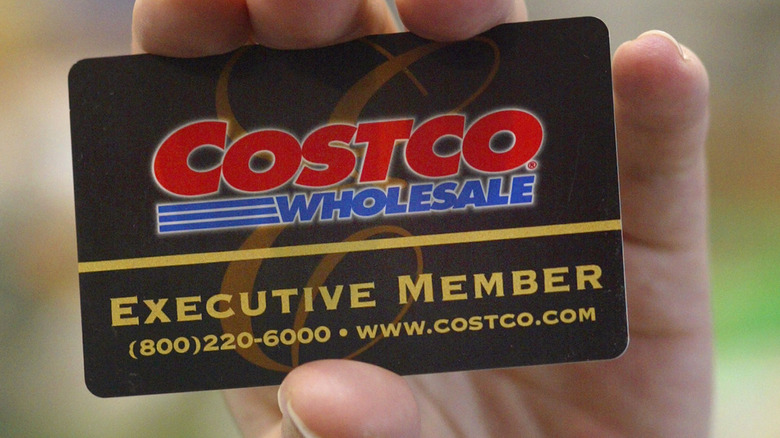 Hand holding Costco card