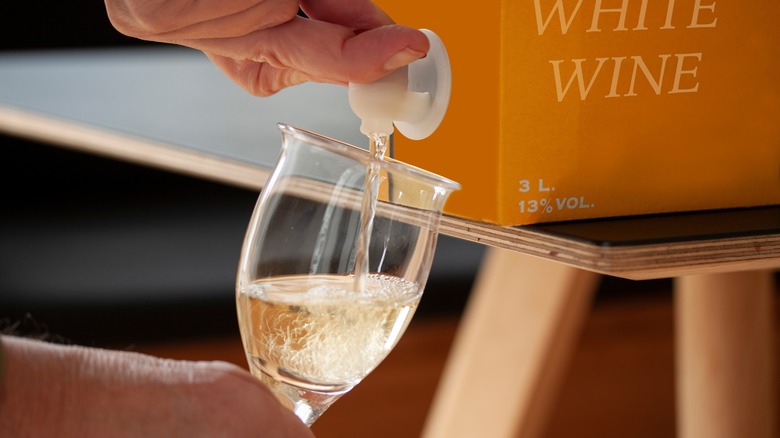 Boxed wine pouring into glass