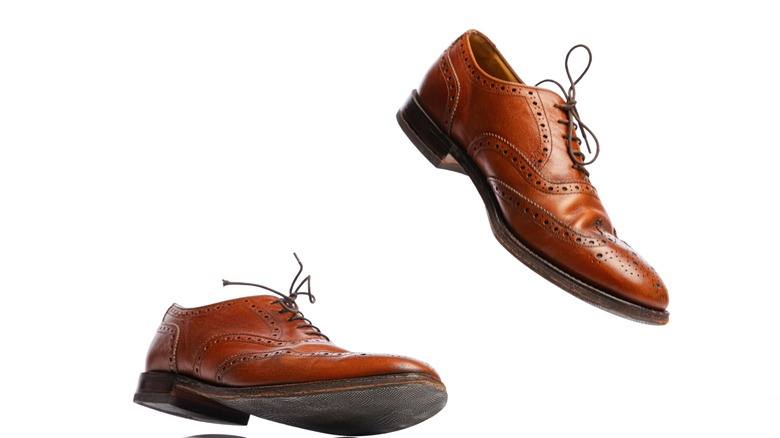 pair of brown dress shoes