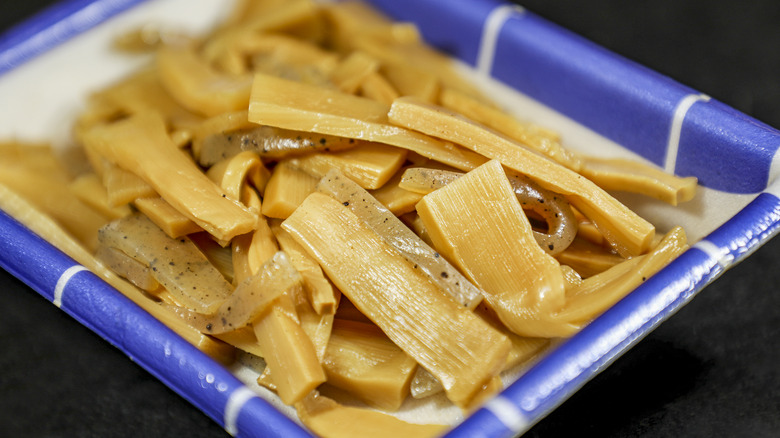 marinated bamboo shoots in blue and white dish