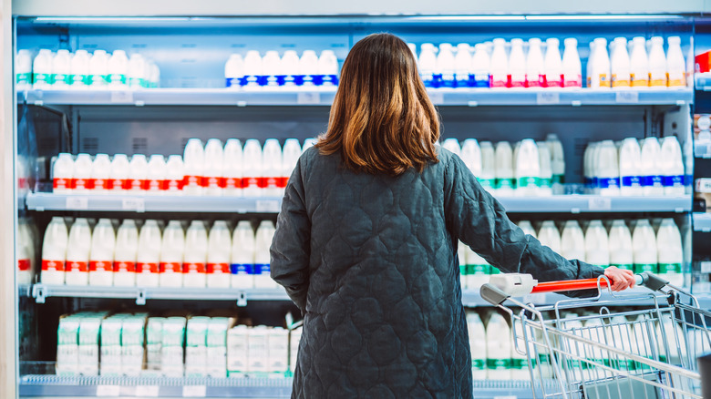 A person shopping for milk.