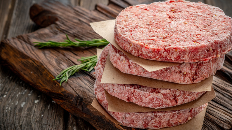 Stack of frozen beef burger patties