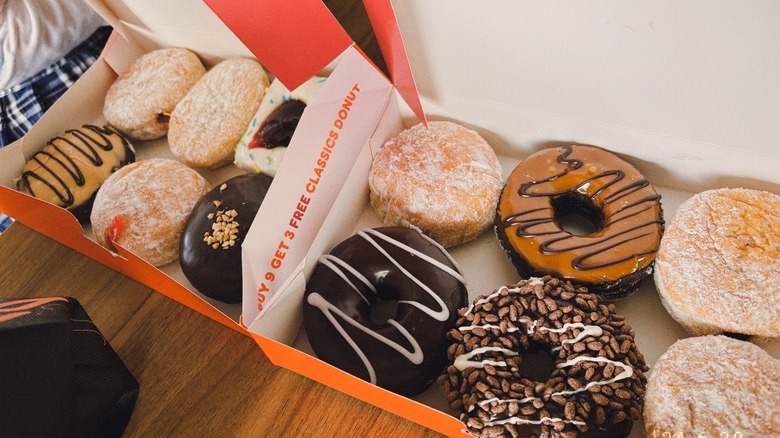 assortment of dunkin' donuts in boxes