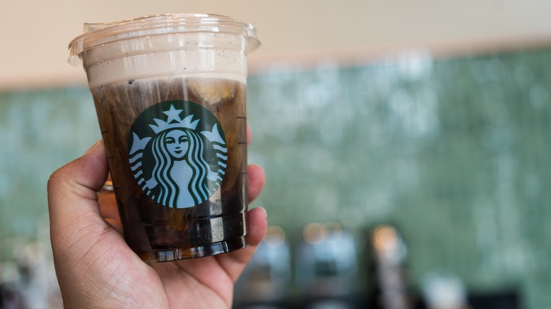 hand holding starbucks iced drink