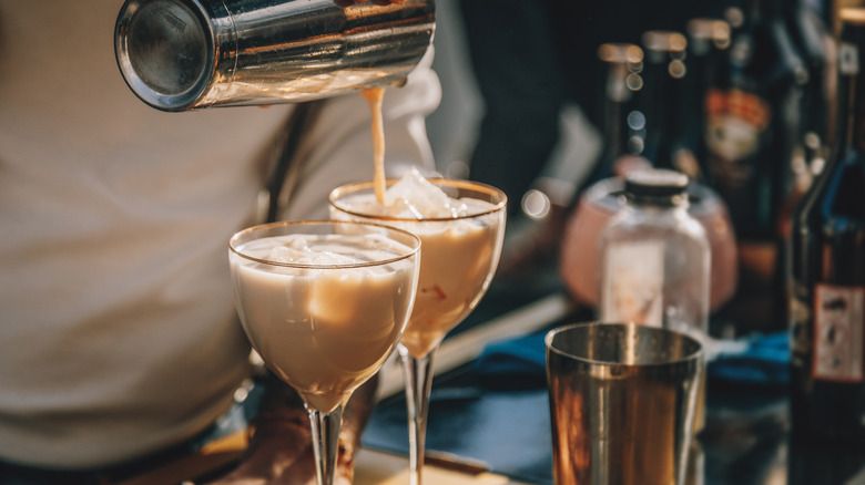 Bartender preparing two cocktails