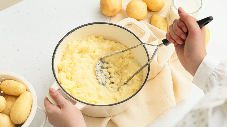 potatoes being mashed