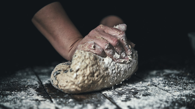 kneading sourdough 