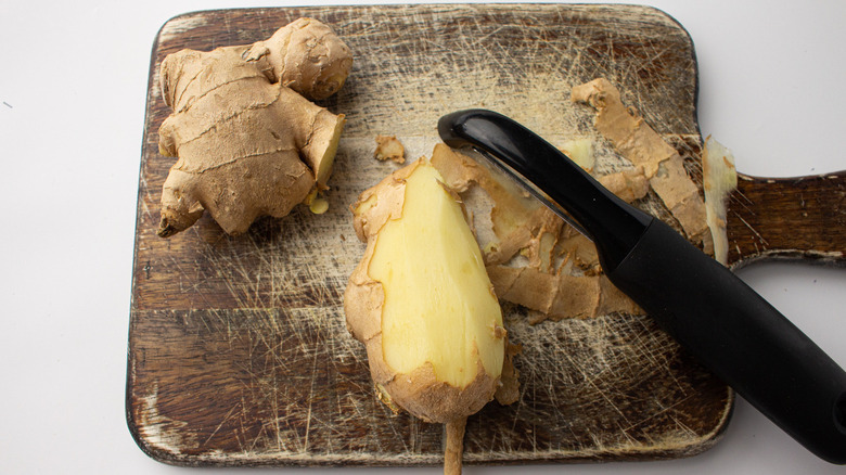 peeled ginger on cutting board