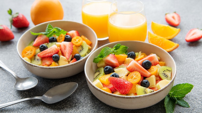 fruit salad with lemon in bowls