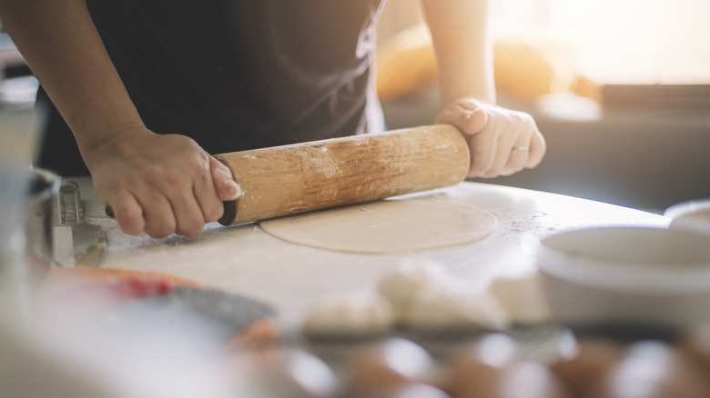 Rolling out biscuit dough