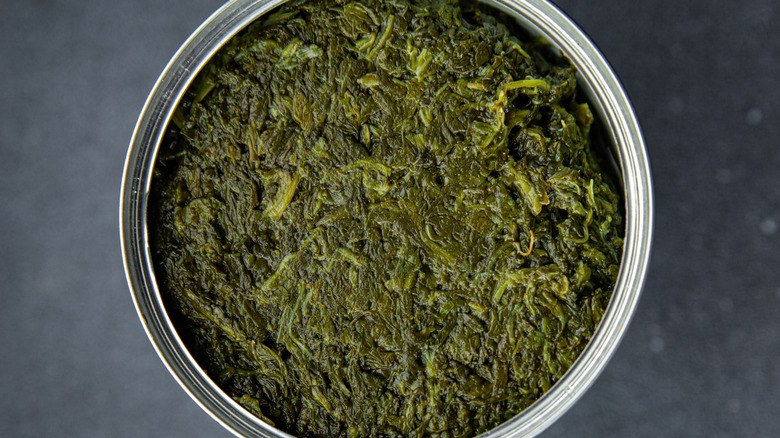 top view of canned spinach on the table copy