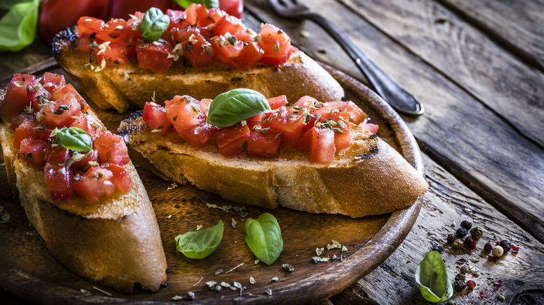 bruschetta served on cutting board