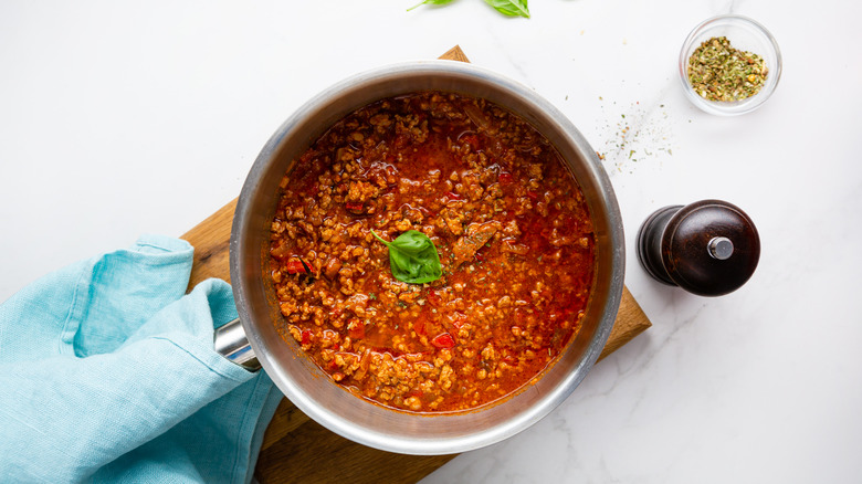 Ground beef in tomato sauce in silver pot