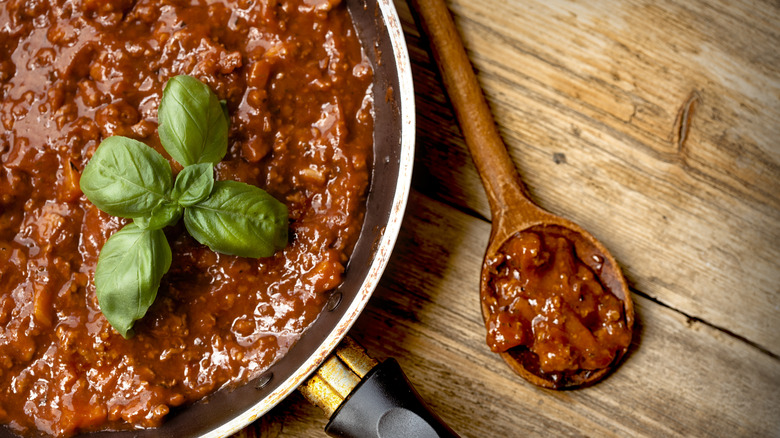 sauce with meat and fresh basil added