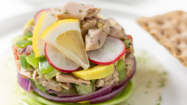 Canned tuna ceviche stacked with fresh vegetables