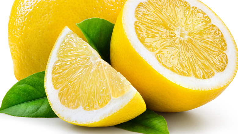 Sliced lemons on white background