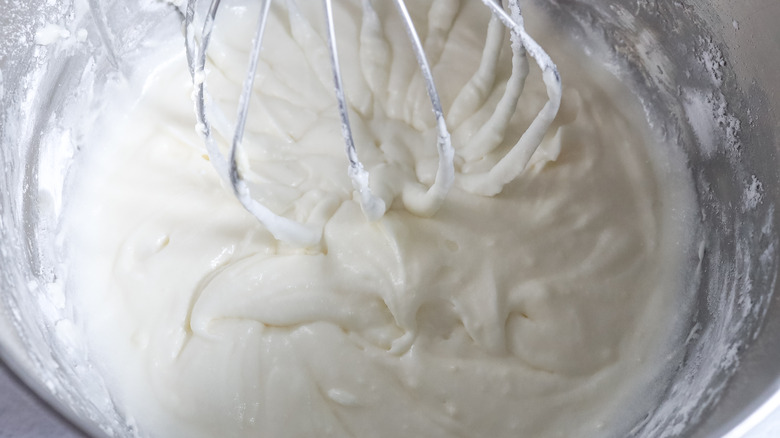 mixing ricotta buttercream frosting