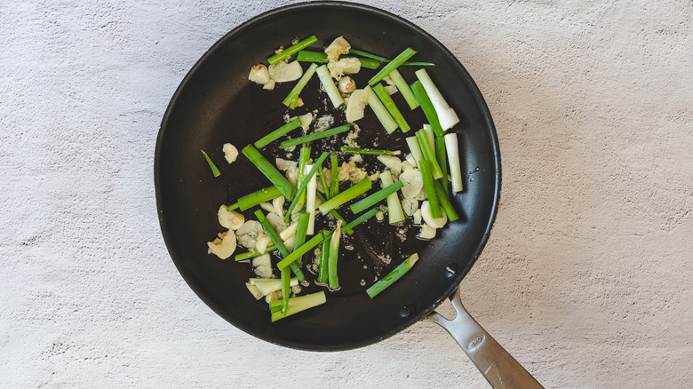 Garlic and scallions in pan