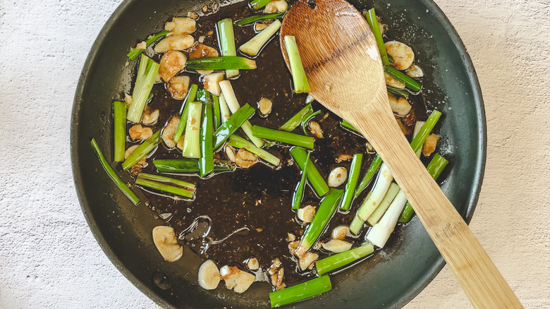 Garlic and scallions in pan