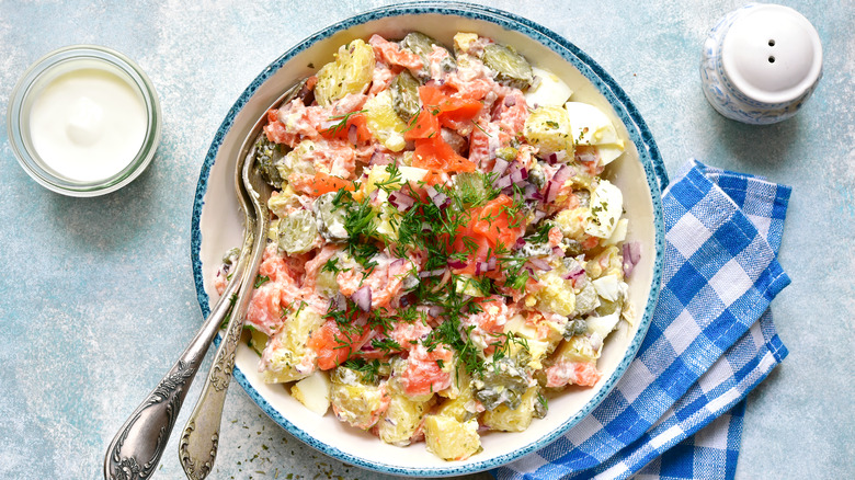 Creamy potato salad with smoked salmon, capers, dill, and pickles