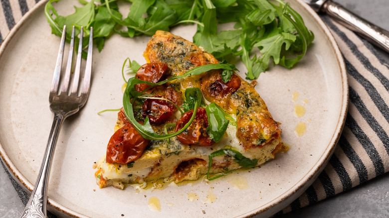 caprese frittata slice with arugula