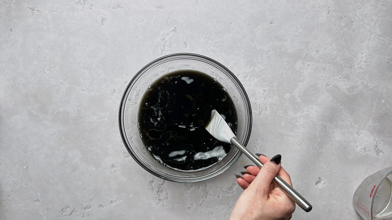 stirring food dye into bowl