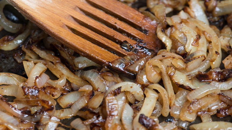 onions being caramelized in pan
