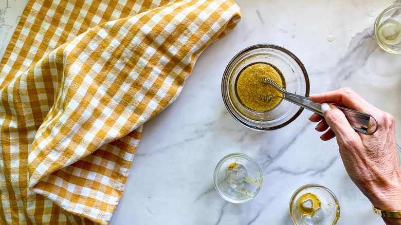 stirring the dressing