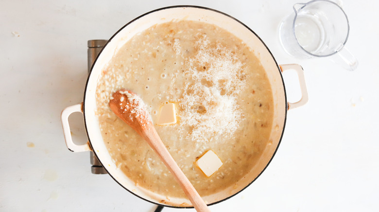 risotto carbonara in pan with butter and cheese