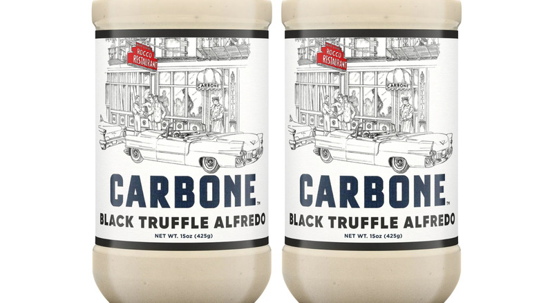 Two jars of Carbone black truffle alfredo