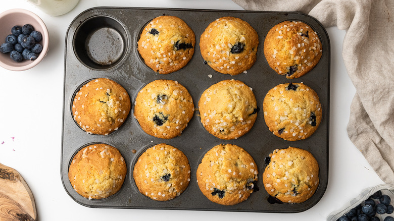 cardamom blueberry muffins in tin