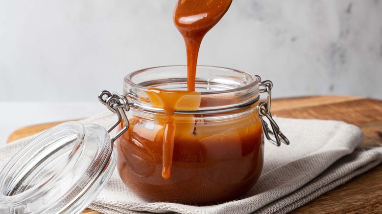 Caramel dripping inside glass container