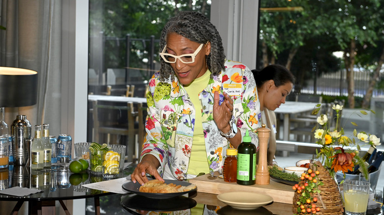 Carla Hall giving cooking demo at Honey Saves Hives event