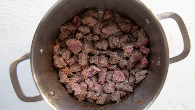 cooked, cubed beef in pan