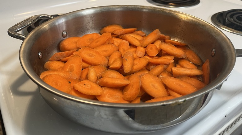 sliced carrots in metal pan