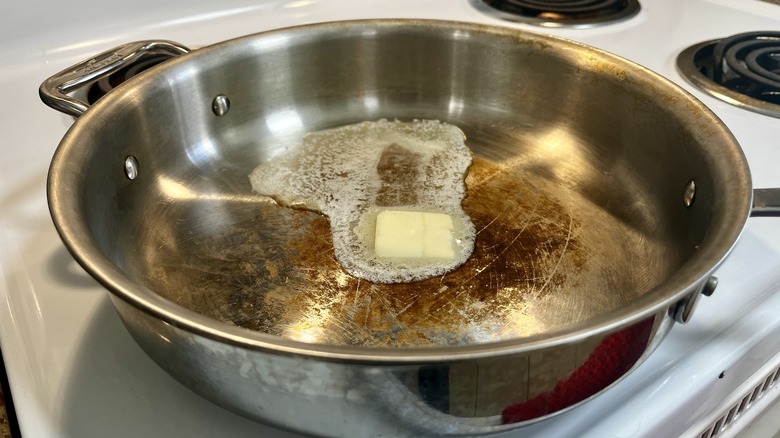 melted butter in metal pan