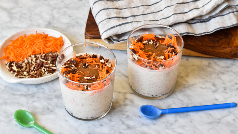 carrot cake overnight oats in glasses with almond butter
