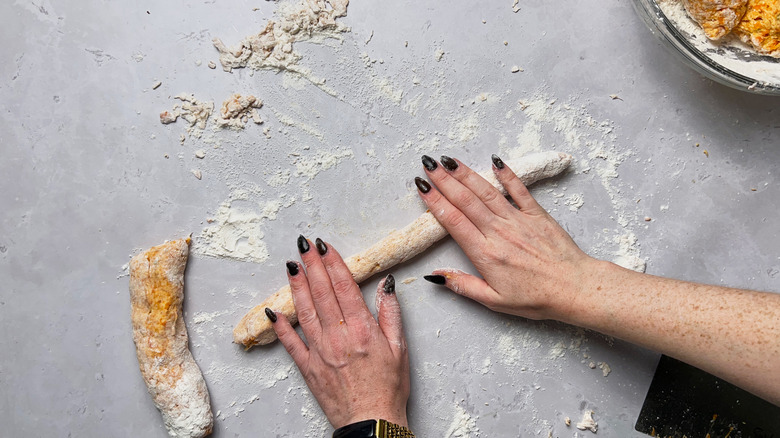 rolling gnocchi dough on table