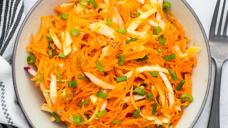 garnished carrot slaw in bowl 