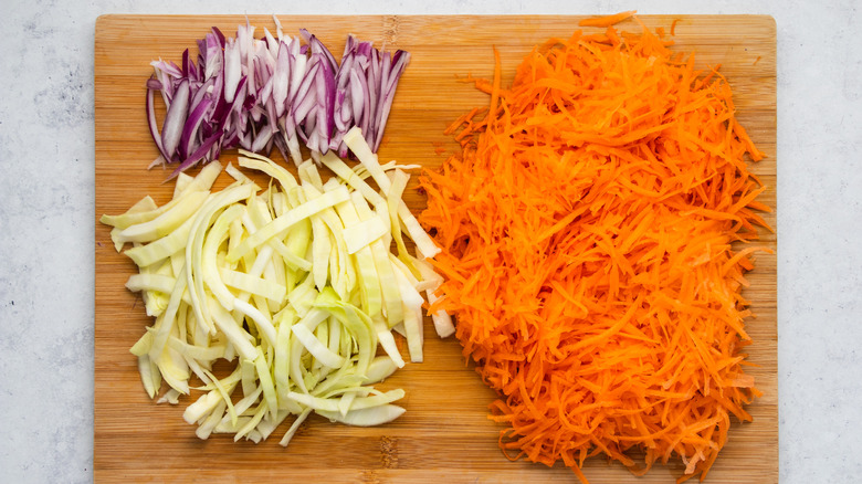 sliced veggies on cutting board 